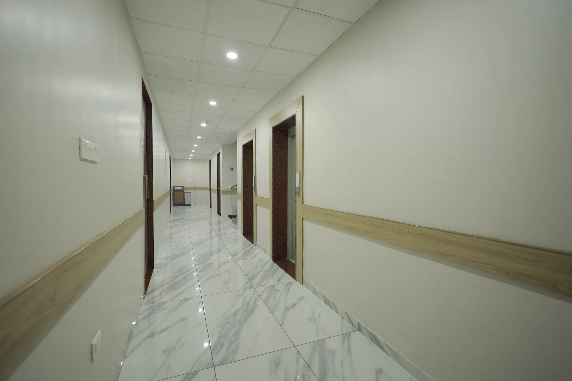 Bright patient corridor inside Deccan Malti Hospital, Sangli